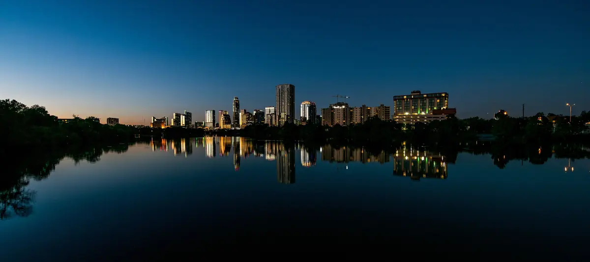 The Austin skyline at dusk reflected in Lady Bird Lake